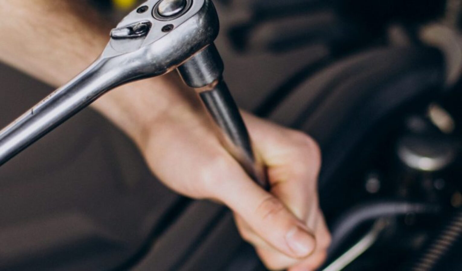 repair-man-making-car-service-scaled-psg88a95dtb1mkopc0qqyqf110gkgsgre8zbyslki8